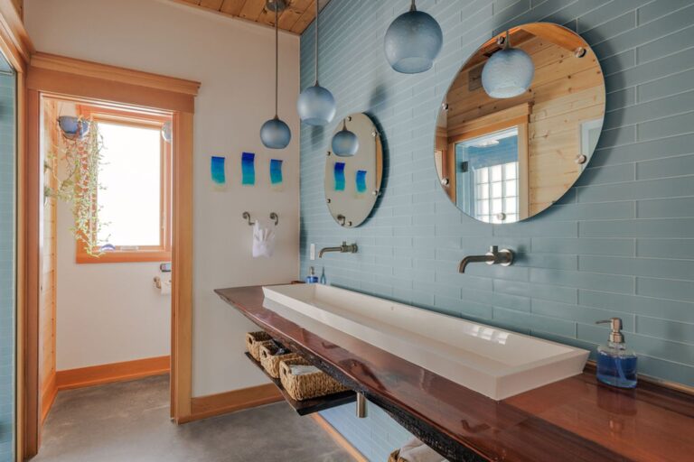 Double vanity with trough sink on a large cedar slab. Private water closet with a high end smart toilet