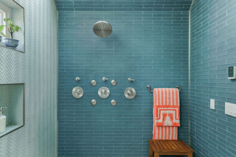 Shower boasts Brizo body jets, shower head and rain shower inside a skylight recess