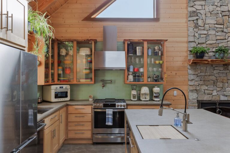 Smeg appliances, Fiesta dishware, and a gas stovetop with a pot filler