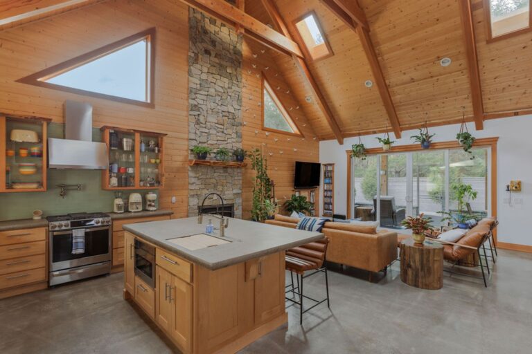 The kitchen, aside from being beautiful, is fully stocked with high end appliances and utensils