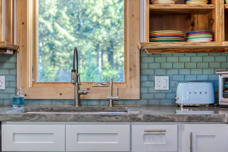 lewis-kitchen-sink-window-colorful-dishes.jpg