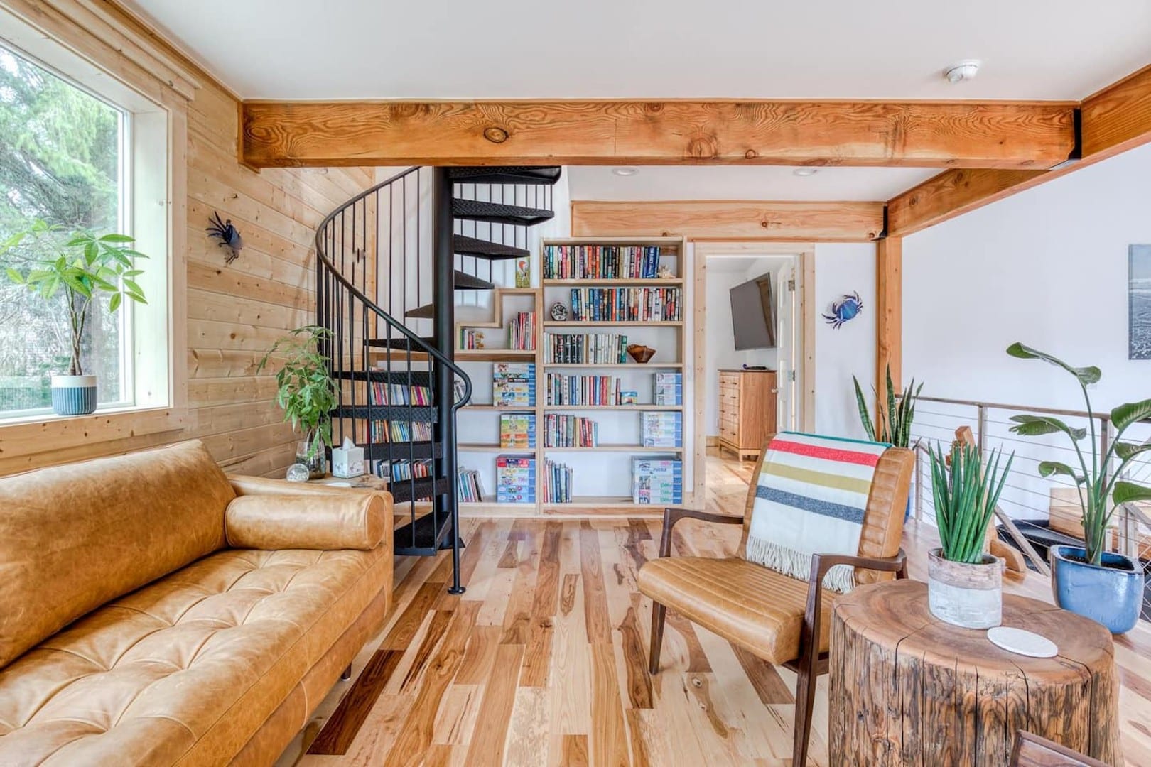 Beach Cabin - Entrance to both master bedrooms, the door on the right, and the spiral stairs on the left.