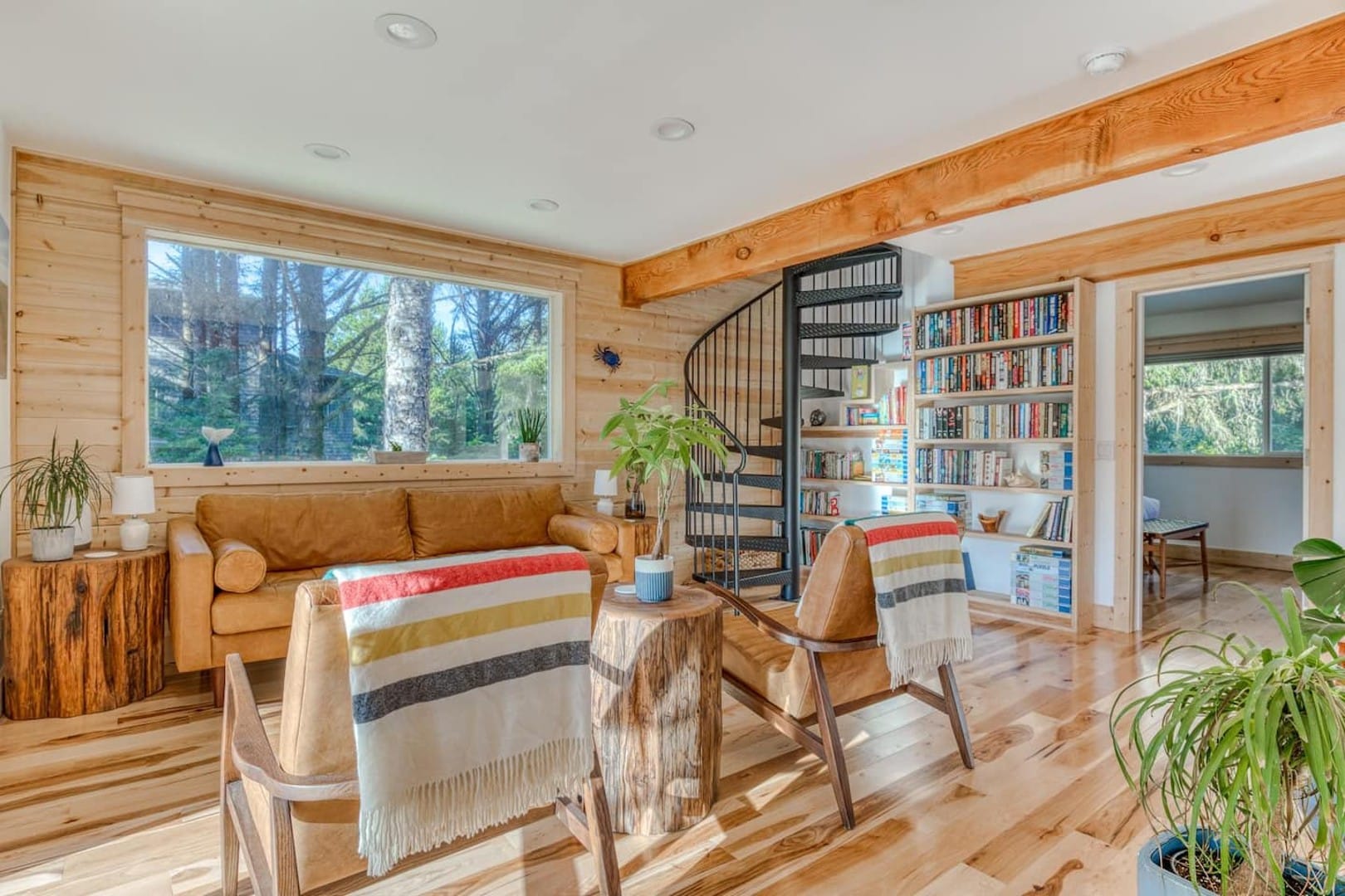 Beach Cabin - Large windows for lots of natural light. Bookcase full of books for all ages, cookbooks, and puzzles.