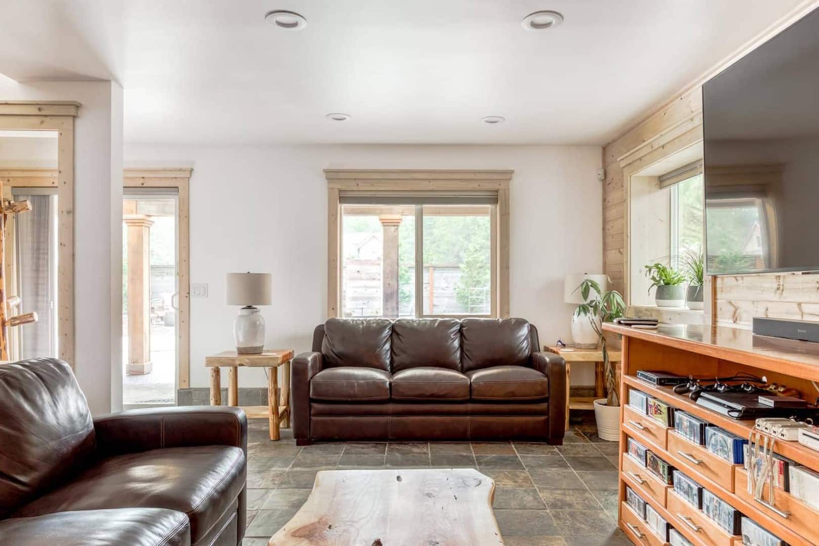 Beach Cabin - TV room has its own half bath and a door to a covered patio with loungers