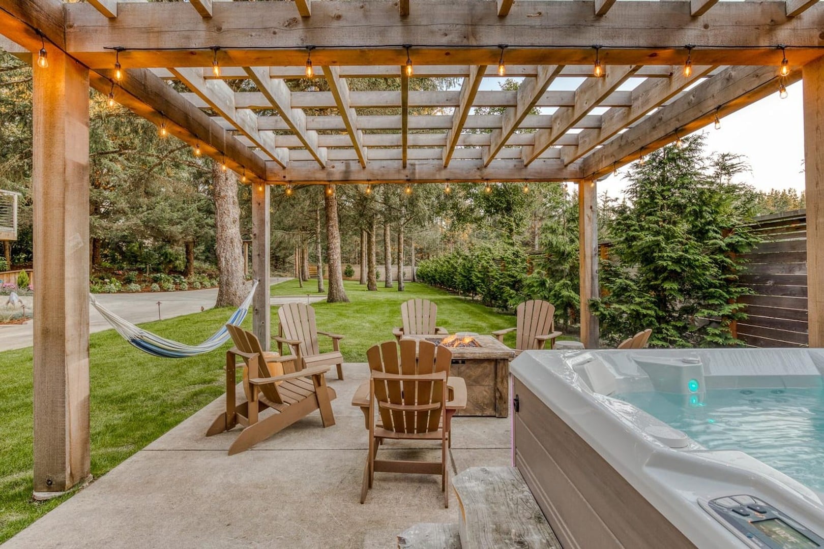 Beach Cabin - The backyard has a custom pergola with large dimensional cedar posts and beams